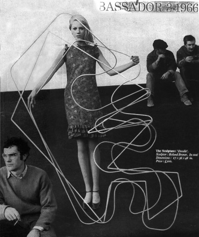 Photograph taken on the roof of St. Martin's School of Art for fashion magazine AMBASSADOR, image of sculpture "Doodle" and Brener with fashion model, London, England. 1966